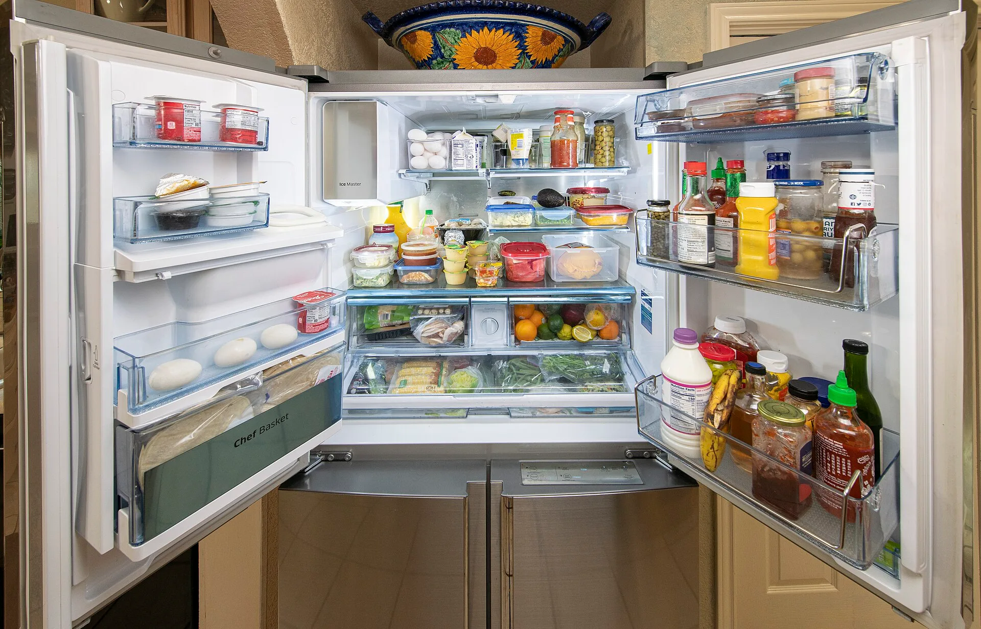 Refrigerator with some poorly stored and placed items for food safety and contributes to food waste, on June 8, 2020, in San Antonio, TX. The refrigerator shows recommended and unrecommended storage practices. It is always recommended to keep your refrigerator and pantry clean and organized so you c. Food safety numbers a new catering kitchen must hit