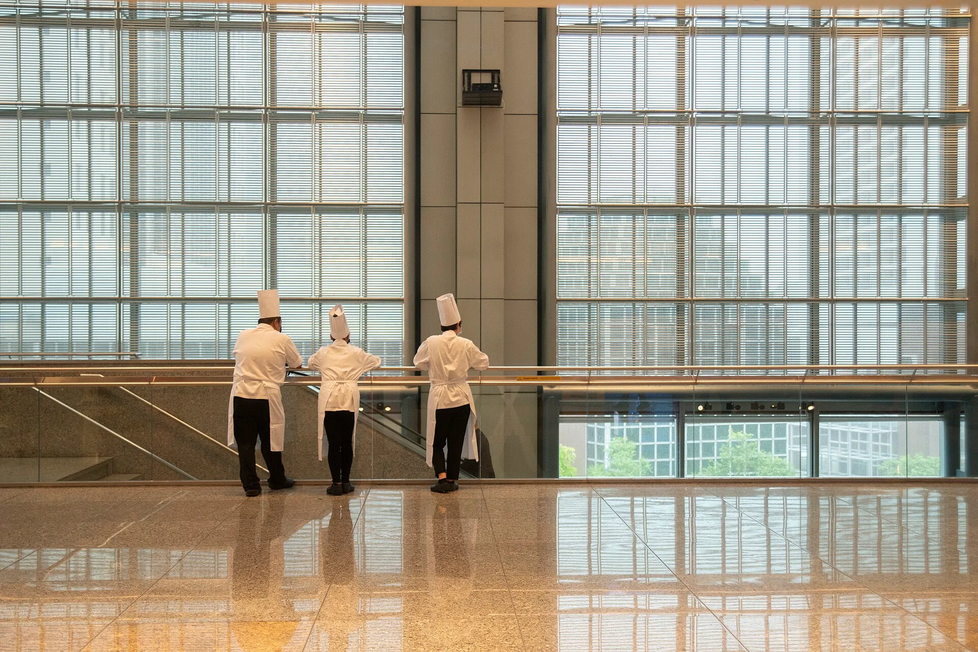 Wikimania 2023 day 3 18 August 2023, catering staff watching the setup of food for attendees. Catering event labor: the eight paid blocks of an event day